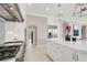 Gourmet kitchen featuring stainless steel appliances, marble countertops, and a spacious island with seating at 628 Chervil Valley Dr, Las Vegas, NV 89138