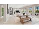 Bright living area with a dining table, fireplace, and large windows at 628 Chervil Valley Dr, Las Vegas, NV 89138