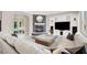 Comfortable living room featuring a fireplace, stone accent wall, and plush seating at 628 Chervil Valley Dr, Las Vegas, NV 89138