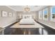 Stylish bedroom with three bright windows, neutral walls, and a large rug at 628 Chervil Valley Dr, Las Vegas, NV 89138
