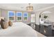 Bright and airy main bedroom suite with sitting room and large windows offering abundant natural light at 628 Chervil Valley Dr, Las Vegas, NV 89138