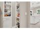 Walk-in pantry with floor-to-ceiling shelving for organized food storage, adjacent to the kitchen at 628 Chervil Valley Dr, Las Vegas, NV 89138