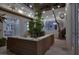 Cozy patio area with an outdoor wicker sectional, trees, and ambient string lights for relaxing evenings at 628 Chervil Valley Dr, Las Vegas, NV 89138
