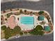 Aerial view of a community pool with lounge chairs and cabanas at 6729 Churnet Valley Ave, Las Vegas, NV 89139