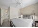 Inviting bedroom with patterned accent wall, stylish light fixtures, and comfortable furniture at 6729 Churnet Valley Ave, Las Vegas, NV 89139