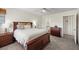 Spacious bedroom with a king-sized bed, carpet flooring, ceiling fan and en-suite bathroom access at 6729 Churnet Valley Ave, Las Vegas, NV 89139