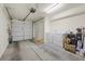 Two-car garage featuring a washer, a dryer, and storage at 6729 Churnet Valley Ave, Las Vegas, NV 89139