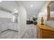 Hallway leading to the kitchen with hardwood floors and natural light at 6729 Churnet Valley Ave, Las Vegas, NV 89139