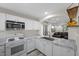 Well-equipped kitchen with white cabinets, stainless steel appliances, and marble countertops at 6729 Churnet Valley Ave, Las Vegas, NV 89139