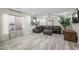 Spacious living room featuring hardwood floors, large windows, and modern decor at 6729 Churnet Valley Ave, Las Vegas, NV 89139