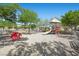 Neighborhood playground featuring various slides, swings, and playground equipment at 6729 Churnet Valley Ave, Las Vegas, NV 89139