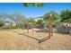 Neighborhood playground featuring various swings and play structures at 6729 Churnet Valley Ave, Las Vegas, NV 89139