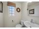 Charming powder room features a pedestal sink and decorative mirror at 6729 Churnet Valley Ave, Las Vegas, NV 89139