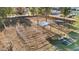 Aerial perspective featuring the equestrian facilities with shelters, fencing, and natural landscape at 6920 Bradley Rd, Las Vegas, NV 89131