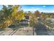 Aerial view of the home and acreage, featuring a large horse area, lush trees and landscaping at 6920 Bradley Rd, Las Vegas, NV 89131