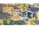 Aerial view features a home next to a large horse property with shelters and well-maintained grounds at 6920 Bradley Rd, Las Vegas, NV 89131