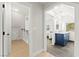 Well-lit bathroom with stylish blue vanity and tiled floors at 6920 Bradley Rd, Las Vegas, NV 89131