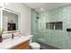 Stylish bathroom features a modern vanity and a shower with unique hexagon tile and built-in niche at 6920 Bradley Rd, Las Vegas, NV 89131