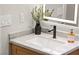 Close up on the bathroom counter featuring a modern faucet and light-up mirror at 6920 Bradley Rd, Las Vegas, NV 89131