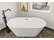 Freestanding tub with modern fixtures and tile flooring at 6920 Bradley Rd, Las Vegas, NV 89131