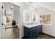 Modern bathroom features dual sinks, marble countertop, and decorative mirrors at 6920 Bradley Rd, Las Vegas, NV 89131