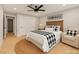 Comfortable bedroom with ceiling fan, cozy armchair, and a farmhouse theme at 6920 Bradley Rd, Las Vegas, NV 89131