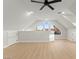 Bonus room featuring unique windows, light wood floors, and modern ceiling fan at 6920 Bradley Rd, Las Vegas, NV 89131