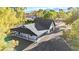 Sprawling ranch property showcasing large covered parking, mature trees, and mountain views at 6920 Bradley Rd, Las Vegas, NV 89131