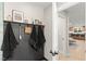 View of hall coat rack leading to a kitchen with bar stool seating at 6920 Bradley Rd, Las Vegas, NV 89131