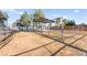 Horse property has pipe fence with shelters and ample space for livestock at 6920 Bradley Rd, Las Vegas, NV 89131