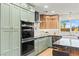 Gourmet kitchen with stainless steel appliances, shaker cabinets, and granite countertops at 6920 Bradley Rd, Las Vegas, NV 89131