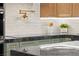 Close-up of a modern kitchen with stylish cabinets, a pot filler, and elegant countertops at 6920 Bradley Rd, Las Vegas, NV 89131
