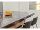 Kitchen island with bar seating, granite countertops, and ample space at 6920 Bradley Rd, Las Vegas, NV 89131