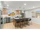Bright kitchen featuring sleek cabinetry, an island with bar stools, and modern appliances, perfect for cooking at 6920 Bradley Rd, Las Vegas, NV 89131