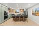 Modern kitchen with stylish cabinets, an island with seating, and stainless steel appliances at 6920 Bradley Rd, Las Vegas, NV 89131