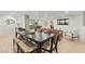 Open-concept living space with a dining area, kitchen island, and a comfortable seating area at 6920 Bradley Rd, Las Vegas, NV 89131