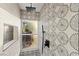 Custom shower with designer tile and overhead shower head at 6920 Bradley Rd, Las Vegas, NV 89131