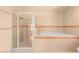 A bathroom features a soaking tub and a separate glass enclosed shower at 7110 La Cienega St, Las Vegas, NV 89119