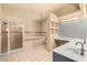 A bathroom features dual sinks, a tub, and a shower stall at 7110 La Cienega St, Las Vegas, NV 89119