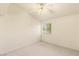 A bright bedroom features carpet, a ceiling fan, and a window providing natural light at 7110 La Cienega St, Las Vegas, NV 89119