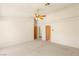 A spacious carpeted bedroom offers a ceiling fan and two closets for ample storage at 7110 La Cienega St, Las Vegas, NV 89119