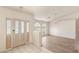 Inviting foyer with tiled floors, decorative front door, and a spacious living area with wood floors at 7110 La Cienega St, Las Vegas, NV 89119