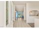 Bright foyer with tiled floors leading to a naturally lit area and glass doors to the backyard at 7110 La Cienega St, Las Vegas, NV 89119