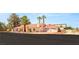 Expansive view of a single-story home featuring a terracotta roof and a three-car garage at 7110 La Cienega St, Las Vegas, NV 89119