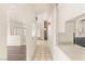 Open hallway with archways and tile flooring showcases flow between rooms and updated features at 7110 La Cienega St, Las Vegas, NV 89119