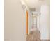 Hallway illuminated with modern lighting fixtures and sleek, wood-look flooring at 7110 La Cienega St, Las Vegas, NV 89119