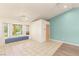Open living room with large windows, tile floors, and adjacent seating area, offering a comfortable space at 7110 La Cienega St, Las Vegas, NV 89119