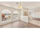 Airy living room boasting wood floors, arched windows, and stylish lighting at 7110 La Cienega St, Las Vegas, NV 89119