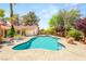 Refreshing backyard pool surrounded by mature trees, a sunning deck, and a built-in spa for ultimate relaxation at 7110 La Cienega St, Las Vegas, NV 89119