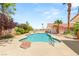 Large private pool and spa in backyard with rock details and mature landscaping at 7110 La Cienega St, Las Vegas, NV 89119